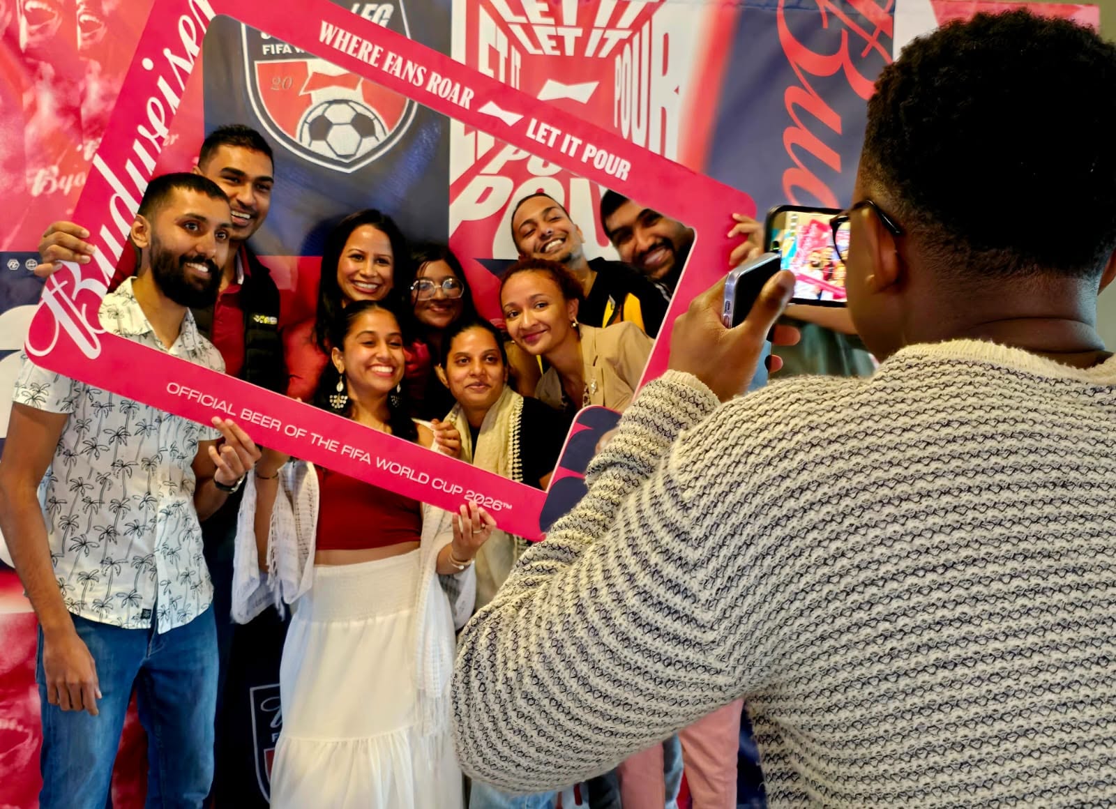 Guests posing with Budweiser FIFA World Cup 2026 frame